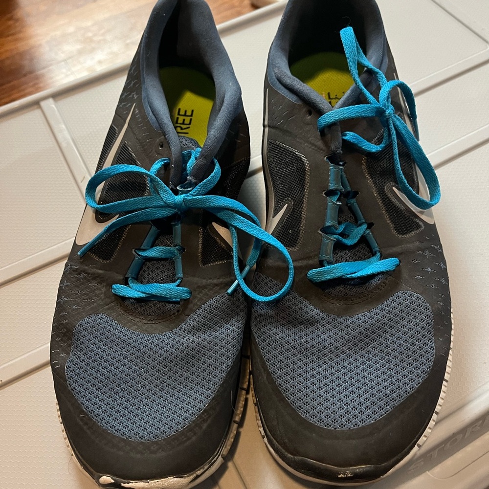 Nike Blue and Black Athletic Shoes with Breathable Mesh and Vibrant Laces